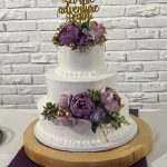 Three-Tier White Cake with Purple Roses